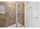 Modern shower with glass door and tile surround at 13144 E 109Th Pl, Commerce City, CO 80022