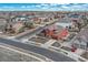 Expansive aerial view of a red two-story home and surrounding neighborhood at 21606 E Idyllwilde Dr, Parker, CO 80138