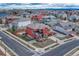 Stunning aerial view of a red two-story home with fenced yard in neighborhood at 21606 E Idyllwilde Dr, Parker, CO 80138