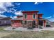 View of the backyard and brick patio featuring outdoor furniture, fencing, and green grass at 21606 E Idyllwilde Dr, Parker, CO 80138