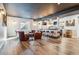 Finished basement featuring a custom bar, ample seating, and a sleek entertainment area at 21606 E Idyllwilde Dr, Parker, CO 80138