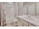 Well-lit bathroom featuring a shower-tub combination and a neutral color scheme at 21606 E Idyllwilde Dr, Parker, CO 80138