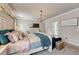 Bedroom with a bright chandelier with a bed and dresser at 21606 E Idyllwilde Dr, Parker, CO 80138