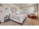 Cozy bedroom featuring soft lighting, decorative wall hangings, and a comfortable seating area at 21606 E Idyllwilde Dr, Parker, CO 80138