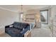 Cozy bedroom with rustic wood accent wall and windows with lots of natural light at 21606 E Idyllwilde Dr, Parker, CO 80138
