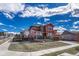 Exterior view of a two-story home with attached garage and manicured lawn at 21606 E Idyllwilde Dr, Parker, CO 80138