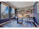 Bright home office with a built-in desk, open shelving, and a large window offering natural light at 21606 E Idyllwilde Dr, Parker, CO 80138
