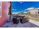 Outdoor patio with wicker seating area near a fenced yard and red home exterior at 21606 E Idyllwilde Dr, Parker, CO 80138