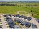 Aerial view of new homes, green space, and a walking path on a sunny day at 1425 Hart Ln, Elizabeth, CO 80107