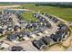 Aerial view of a residential neighborhood with community ponds and green spaces, showing layout and surrounding area at 1425 Hart Ln, Elizabeth, CO 80107