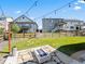 Spacious backyard featuring a modern fire pit area and lush green grass, a great space to gather outdoors at 1425 Hart Ln, Elizabeth, CO 80107