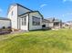 Backyard with a patio, garden, and grill, ideal for outdoor living and entertaining in the warmer months at 1425 Hart Ln, Elizabeth, CO 80107