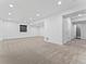 Expansive finished basement with recessed lighting and a door at 1425 Hart Ln, Elizabeth, CO 80107