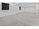 Spacious finished basement with neutral carpet and ample natural light from two windows at 1425 Hart Ln, Elizabeth, CO 80107