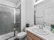 Bathroom featuring modern shower and vanity with under-sink storage at 1425 Hart Ln, Elizabeth, CO 80107