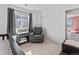 Bedroom showcasing a cozy reading chair and window view at 1425 Hart Ln, Elizabeth, CO 80107