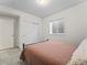 Bedroom showcasing a simple bed frame and closet at 1425 Hart Ln, Elizabeth, CO 80107