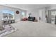 Expansive bonus room with many windows offers natural light and ample space for a variety of activities at 1425 Hart Ln, Elizabeth, CO 80107