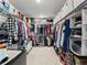 Expansive walk-in closet features rods and shelves providing ample storage for clothes, shoes, and accessories at 1425 Hart Ln, Elizabeth, CO 80107