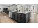 Kitchen island with seating and storage, connects to living room and dining area at 1425 Hart Ln, Elizabeth, CO 80107