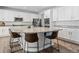 Spacious kitchen with white cabinets, stainless steel appliances, granite countertops, and a large central island at 1425 Hart Ln, Elizabeth, CO 80107