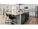 Kitchen with black island, granite countertops, stainless steel appliances and breakfast bar at 1425 Hart Ln, Elizabeth, CO 80107