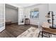 Bright office space with wood floors, large window, french doors, and desk is ideal for working at home at 1425 Hart Ln, Elizabeth, CO 80107