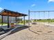 Community playground with picnic shelter, swings, slide, and views of surrounding green space at 1425 Hart Ln, Elizabeth, CO 80107