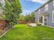 Spacious backyard with a lush lawn, patio, and privacy fence at 9865 Centre Cir, Parker, CO 80134