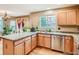 This kitchen is updated with granite countertops, stainless appliances, and hardwood floors at 9865 Centre Cir, Parker, CO 80134