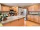 Spacious kitchen featuring wooden cabinets, granite countertops and stainless steel appliances at 9865 Centre Cir, Parker, CO 80134