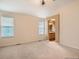 Spacious bedroom featuring vaulted ceilings and an ensuite bathroom with modern fixtures at 9865 Centre Cir, Parker, CO 80134