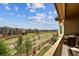 Enjoy scenic views from this home's private balcony with a grill at 16902 W 94Th Pl, Arvada, CO 80007