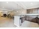 Finished bar area with granite counters and a sink at 16902 W 94Th Pl, Arvada, CO 80007