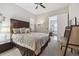 Comfortable bedroom featuring neutral tones, carpet, and a ceiling fan at 16902 W 94Th Pl, Arvada, CO 80007