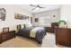 Bedroom with modern decor, plenty of natural light, and hardwood furniture at 16902 W 94Th Pl, Arvada, CO 80007