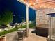 Covered patio featuring a hot tub and seating area with string lights for an inviting outdoor space at 16902 W 94Th Pl, Arvada, CO 80007