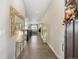 Bright entryway with hardwood floors, offering a glimpse into the home's open floor plan at 16902 W 94Th Pl, Arvada, CO 80007