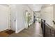 Hallway with decorative features and hard wood floors at 16902 W 94Th Pl, Arvada, CO 80007