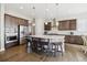 Spacious kitchen featuring wood floors, pendant lighting and stainless steel appliances at 16902 W 94Th Pl, Arvada, CO 80007