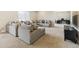 Spacious living room featuring plush seating, neutral colors, and ample natural light at 16902 W 94Th Pl, Arvada, CO 80007