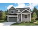 Charming two-story home with gray siding, white trim, covered porch, and an attached two-car garage at 8045 Butte Creek St, Littleton, CO 80125