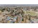 Overhead view of a serene neighborhood features well-maintained homes amidst tree-lined streets, showing the area's tranquility at 2225 Linda Vista Dr, Lakewood, CO 80215