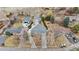 Aerial view of the property showcasing the house, detached garage, and surrounding landscape at 2225 Linda Vista Dr, Lakewood, CO 80215