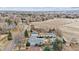 An aerial perspective reveals a quiet neighborhood with mature trees and well-kept homes at 2225 Linda Vista Dr, Lakewood, CO 80215