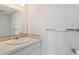 Clean bathroom featuring a stylish vanity with a sink, faucet and large mirror at 2225 Linda Vista Dr, Lakewood, CO 80215