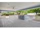 Relax on the expansive covered porch, featuring a luxurious hot tub and scenic views at 2225 Linda Vista Dr, Lakewood, CO 80215