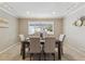 Bright dining room filled with natural light with neutral decor, perfect for enjoying meals with Gathering and friends at 2225 Linda Vista Dr, Lakewood, CO 80215