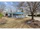 Traditional single Gathering home boasting an inviting exterior, cozy porch, and well-maintained front yard at 2225 Linda Vista Dr, Lakewood, CO 80215