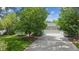 Charming home with a well-manicured front yard and a two-car garage at 2225 Linda Vista Dr, Lakewood, CO 80215
